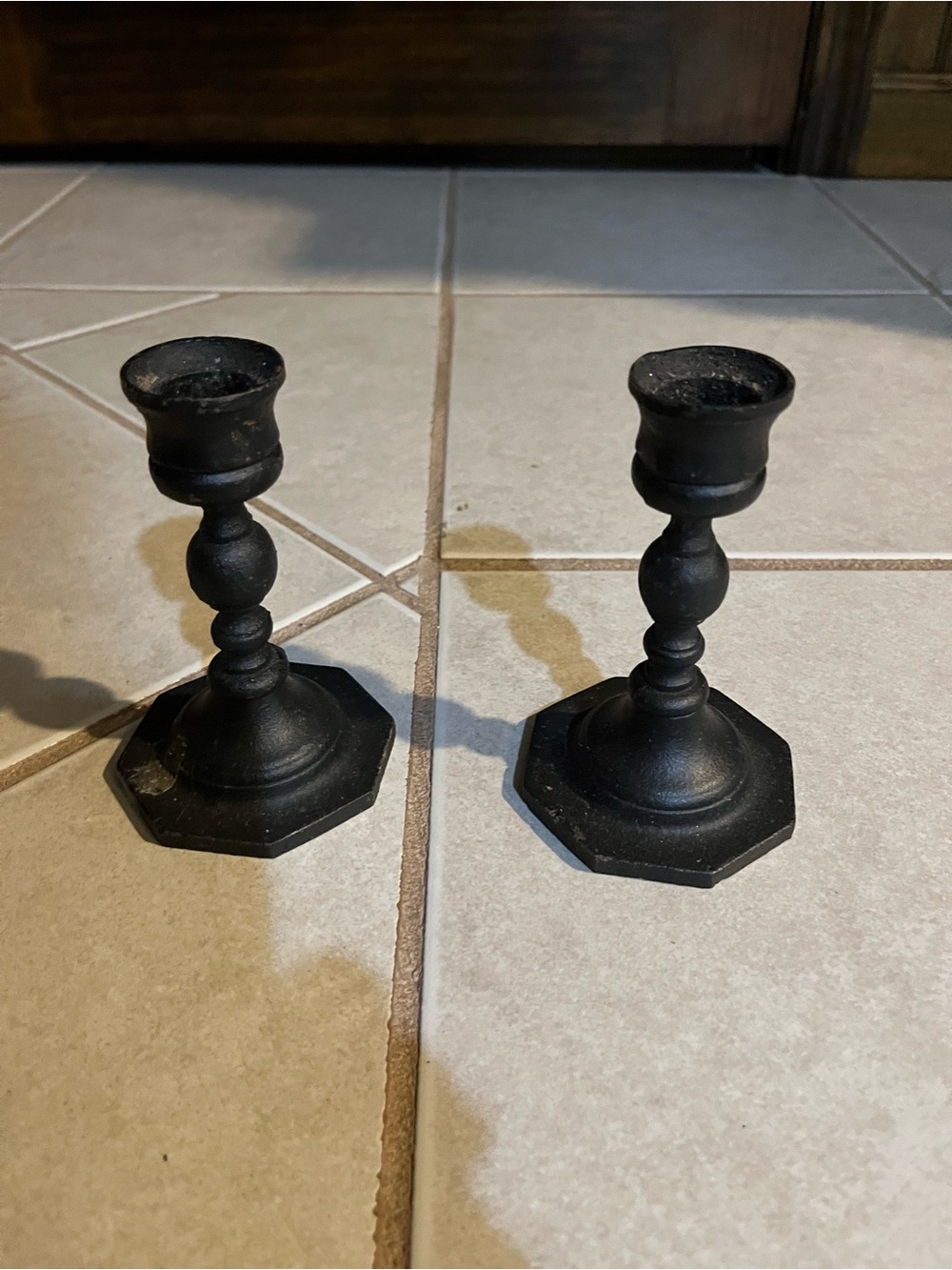 Black cast iron candle holder